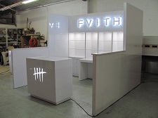 /custom-trade-show-booth-10x10-hard-wall-with-backlit-signs-3